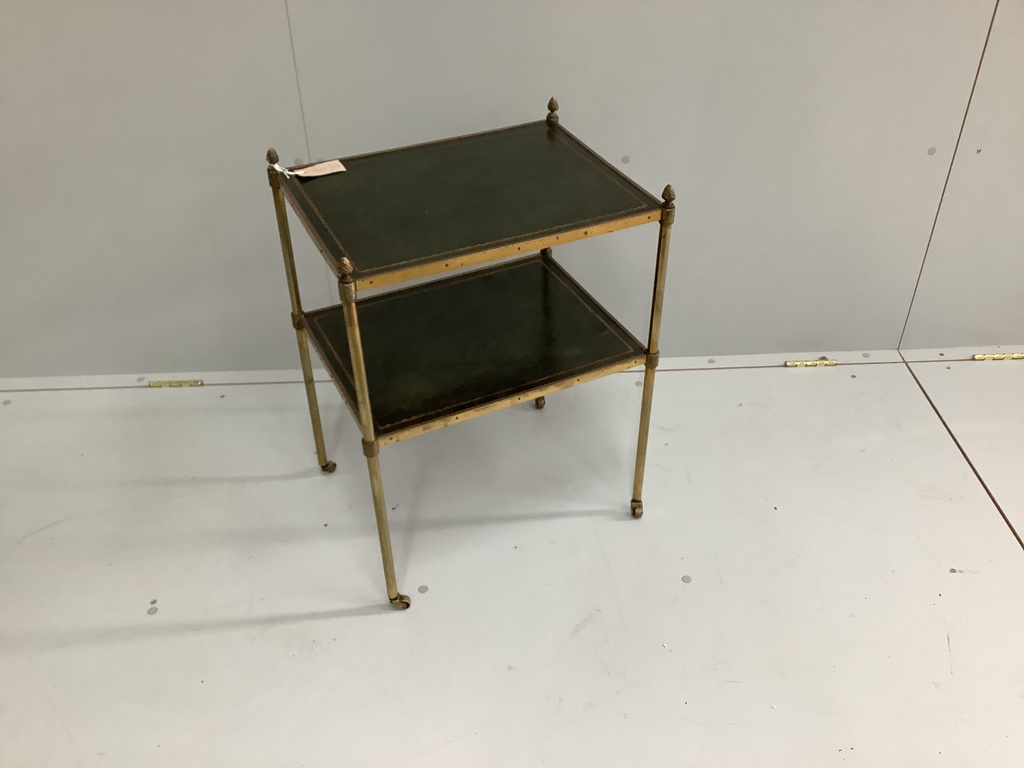 A Maison Jansen style leather inset brass two tier occasional table, width 48cm, depth 37cm, height 64cm